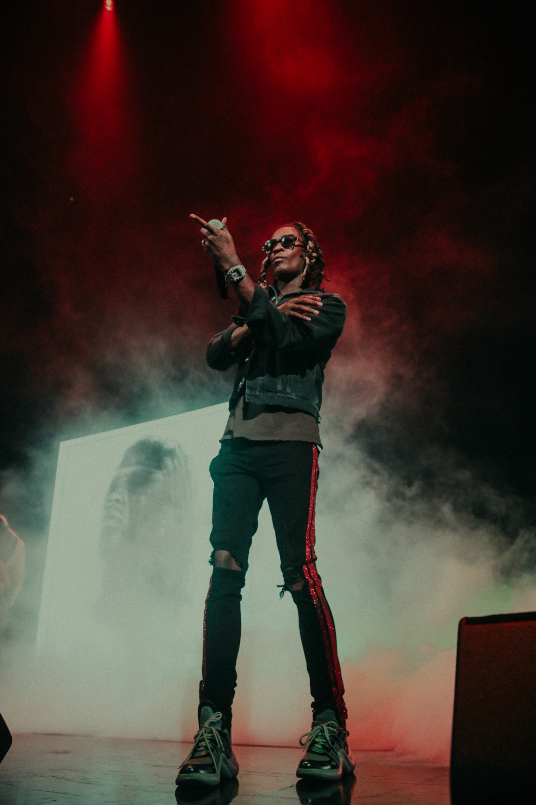 Young Thug in red stage spotlight