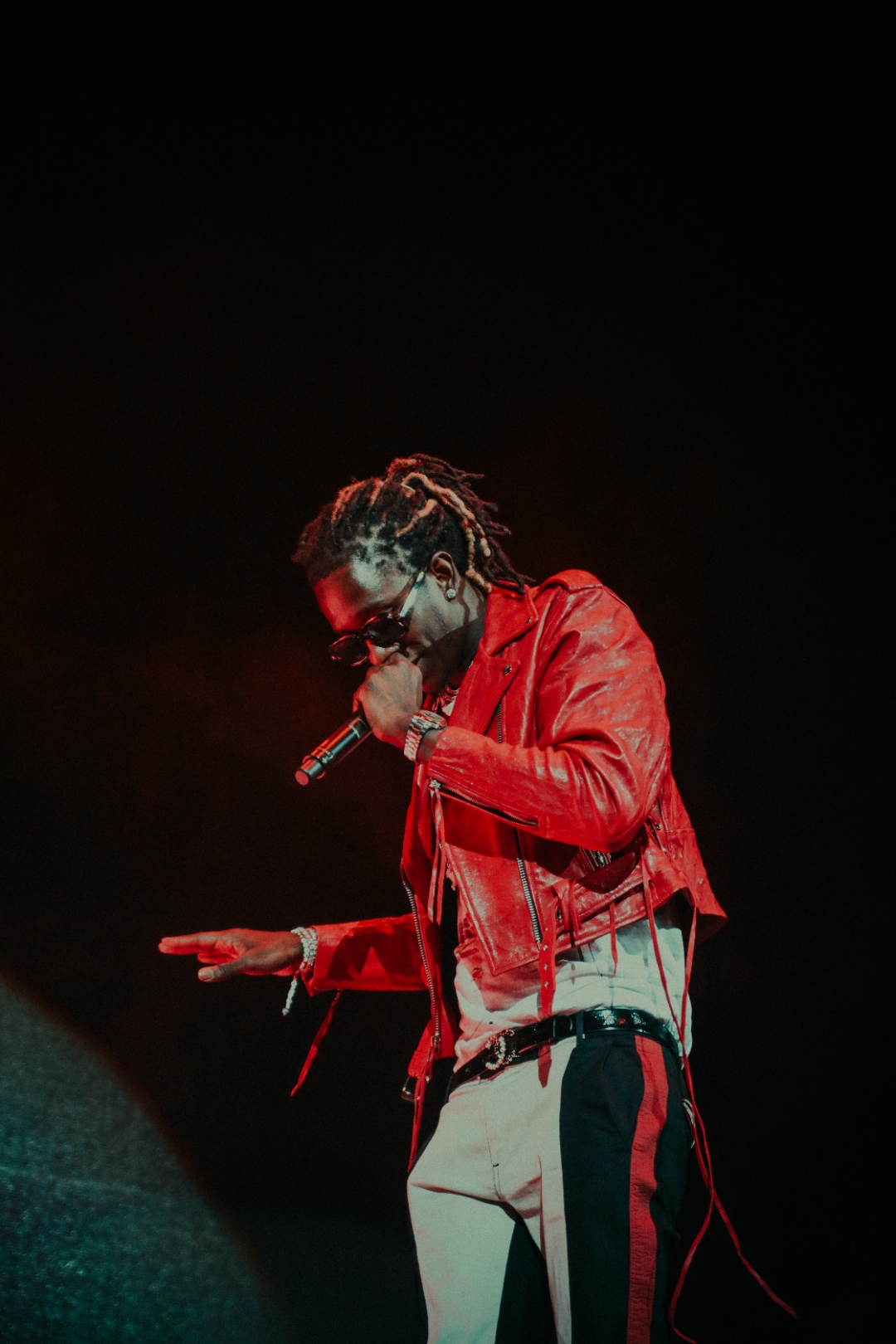 Young Thug in red leather onstage